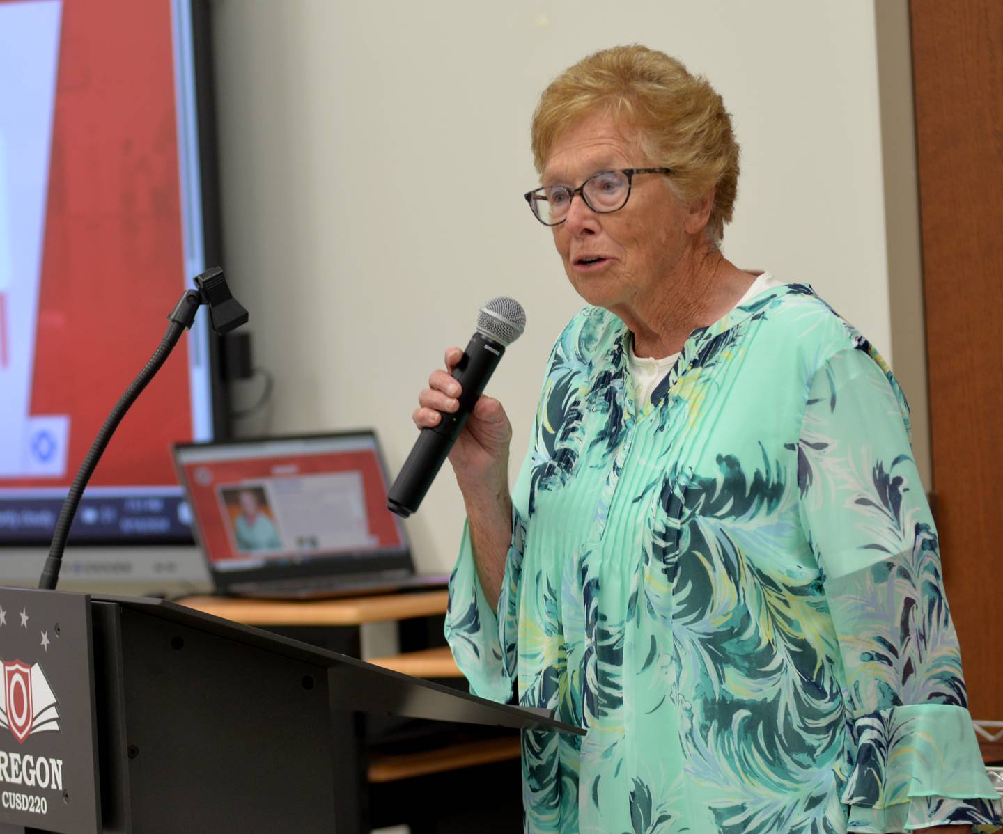 Salley Wessels speaks after being inducted into the OCUSD Hall of Fame during a ceremony on Saturday, Sept. 14, 2024 at the Rock River Center in Oregon.