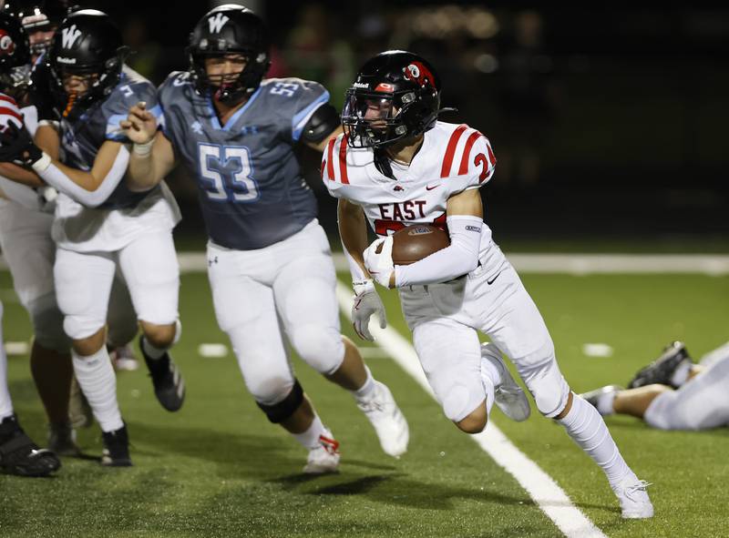 Glenbard East's Valentino Heredia (24) runs against Willowbrook during the varsity football game between Glenbard East and Willowbrook high schools on Friday, Sep. 30, 2024 in Villa Park.