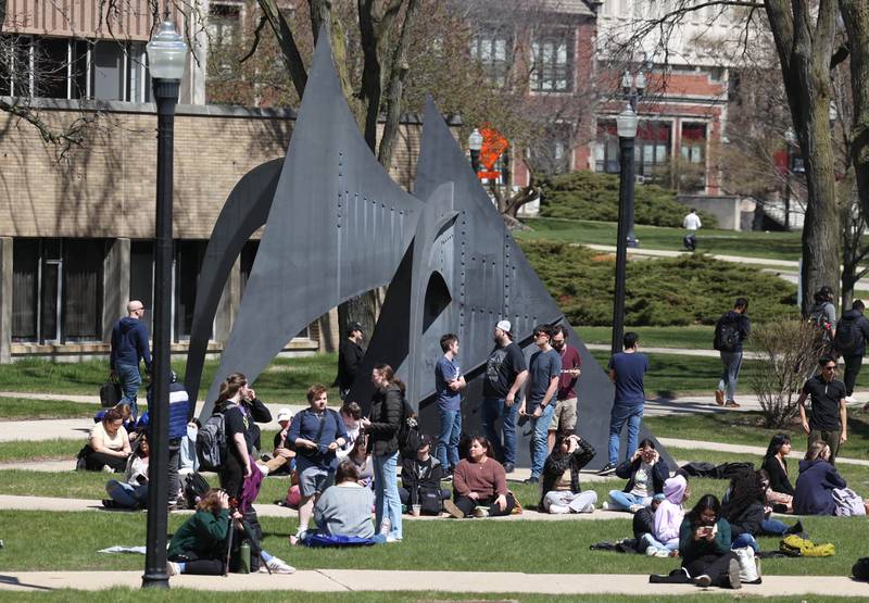 Attendees prepare to watch the eclipse Monday, April 8, 2024, at the Northern Illinois University Solar Eclipse Viewing Party behind Davis Hall in DeKalb. Attendees were treated to perfect weather to watch the rare celestial event.