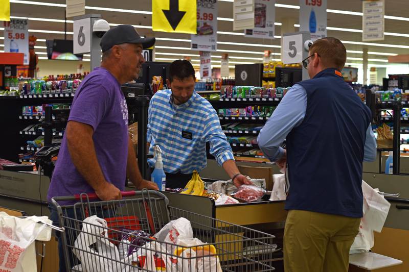 Hometown Hero grand prize winner Matt Ramer checks out at Peru HyVee after his two-minute shopping spree.