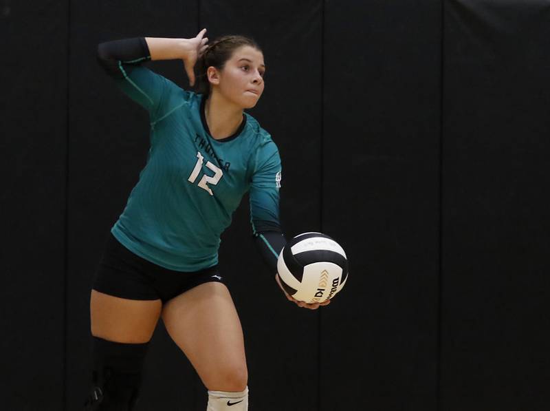 \Woodstock North's Gabriella Schefke serves the ball during a Kishwaukee River Conference volleyball match against Johnsburg on Wednesday, Sept. 4, 2024, at Woodstock North High School.