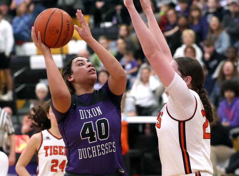 Dixon’s Hallie Williamson shoots over Crystal Lake Central's Leah Spychala during their Class 3A sectional semifinal Tuesday, Feb. 20, 2024, at Sycamore High School.