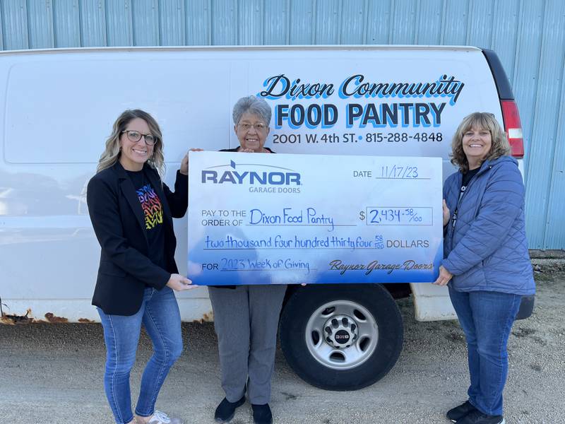 Employees at Raynor Garage Doors demonstrated their commitment to community and core values during the company's fifth annual Raynor Week of Giving, raising over $2,400 and collecting nearly 400 non-perishable food items for the local food pantry. Staci Anderson, Raynor's director of marketing (left), presented the check to the Dixon Community Food Pantry.