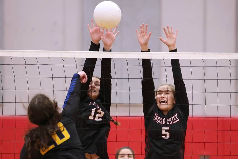 Indian Creek's Isabella Turner (left) and Alexa Anderson try to block Somonauk's Amelia Grace during their regional first round match Tuesday, Oct. 25, 2022, at Aurora Christian High School in Aurora.