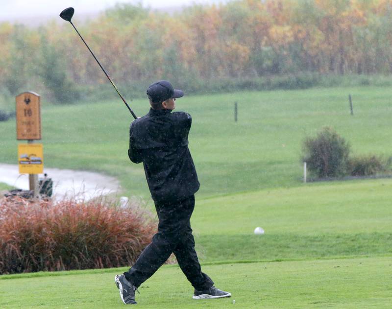 Putnam County's Jacob Edens tees off in the pouring rain during the Class 1A Regional on Wednesday, Sept. 27, 2023 at Wolf Creek Golf Club in Pontiac.