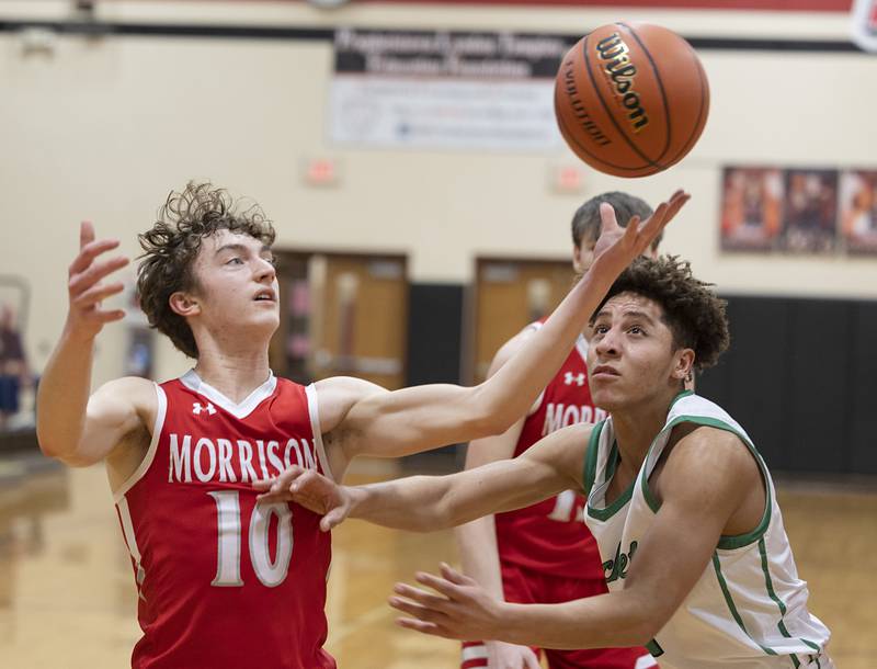 Morrison’s Colton Bielema and Rock Falls’ Devin Tanton-DeJesus look to wrangle a loose ball Wednesday, Feb. 21, 2024 at the Prophestown class 2A basketball regional.