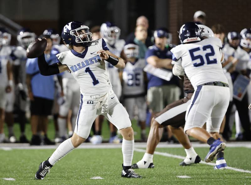 Nazareth's Logan Malachuk (1) throws against Mt. Carmel during the varsity football game between Nazareth Academy and Mt. Carmel high school on Friday, Sep. 13, 2024 in Chicago.