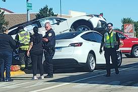 McHenry crash leaves one car on top of another