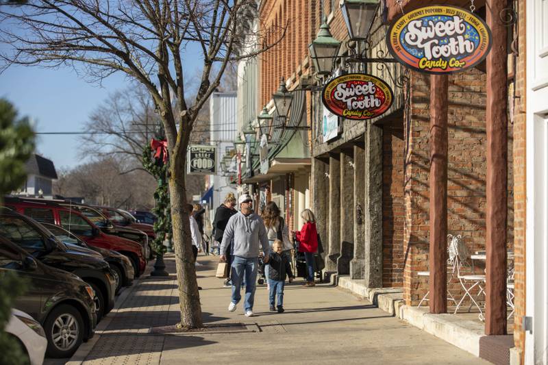 Shoppers walk down Washington Street during Morris Home for the Holidays.