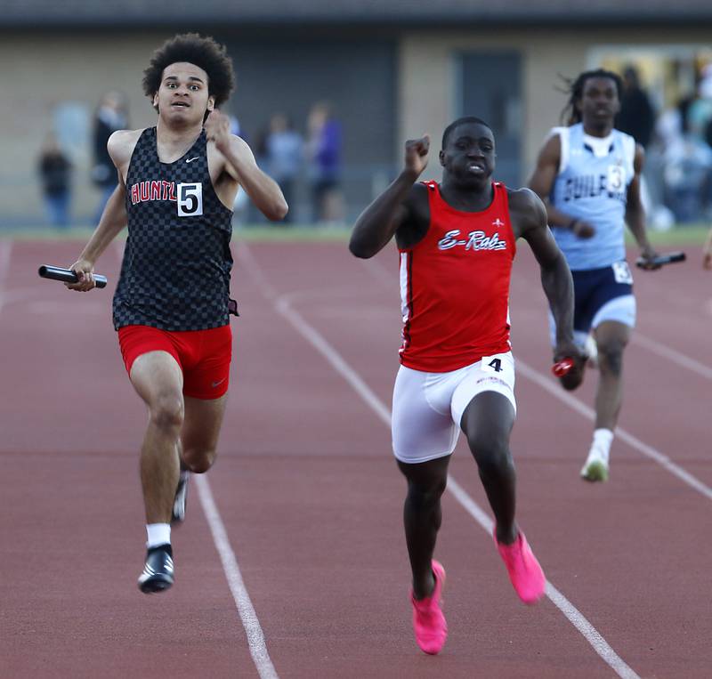 Huntley’s Talon Sargent tries to catch Rockford East’s Mechai Docket-Lewis as the race to the finish line in the 4 x 200 meter relay during the Huntley IHSA Class 3A Boys Sectional Track and Field Meet on Wednesday, May 15, 2024, at Huntley High School.