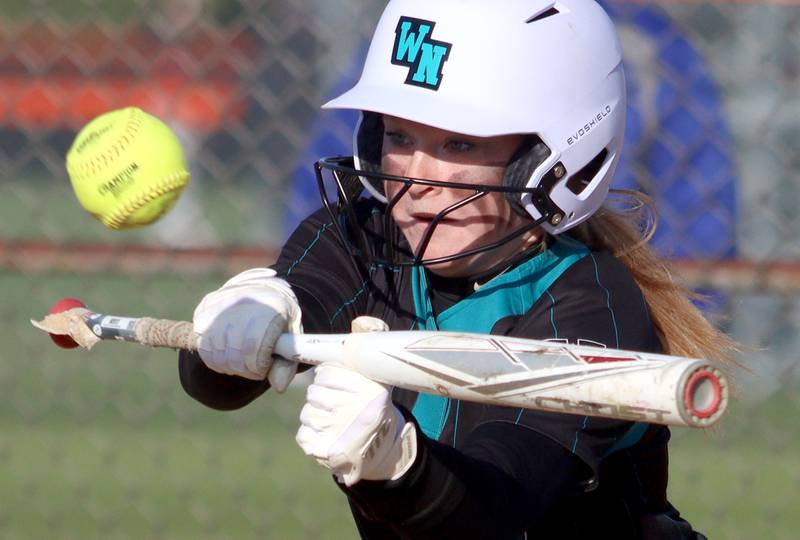 Woodstock North’s Aly Jordan makes contact in varsity softball at Crystal Lake Central Friday.