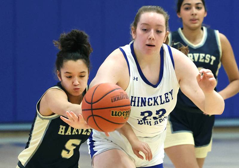 Harvest Christian’s Daphne Brown and Hinckley-Big Rock’s Sami Carlino go after a loose ball Monday, Jan. 8, 2023, during their game at Hinckley-Big Rock High School.