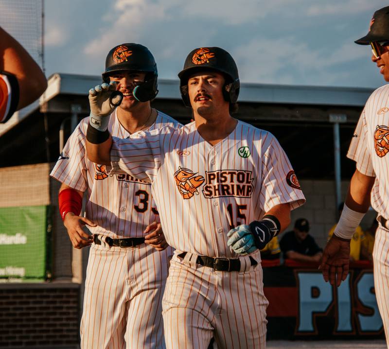 Lucas Smith (15) celebrates after hitting a three-run home run during the first inning of the Illinois Valley Pistol Shrimp's 14-1 victory over the Lafayette Aviators on Wednesday, June 12, 2024 at Schweickert Stadium in Peru.