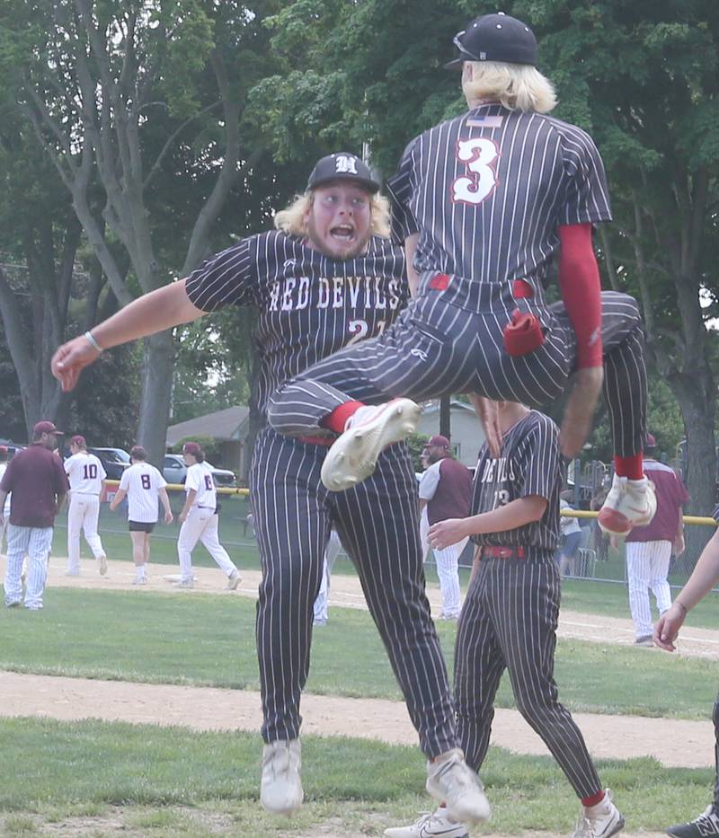 Hall's Joel Koch leaps in the air with teammate Max Bryant after winning the Class 2A Regional title over Chillicothe on Saturday, May 18, 2024 at Kirby Park in Spring Valley.