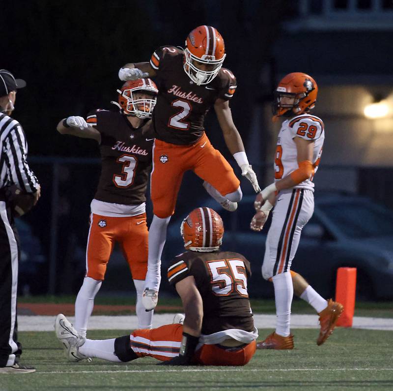 Hersey's Nasir Mckenzie (2) is greeted by teammates after a long touchdown during the IHSA Class 7A playoffs Saturday October 28, 2023 in Arlington Heights.