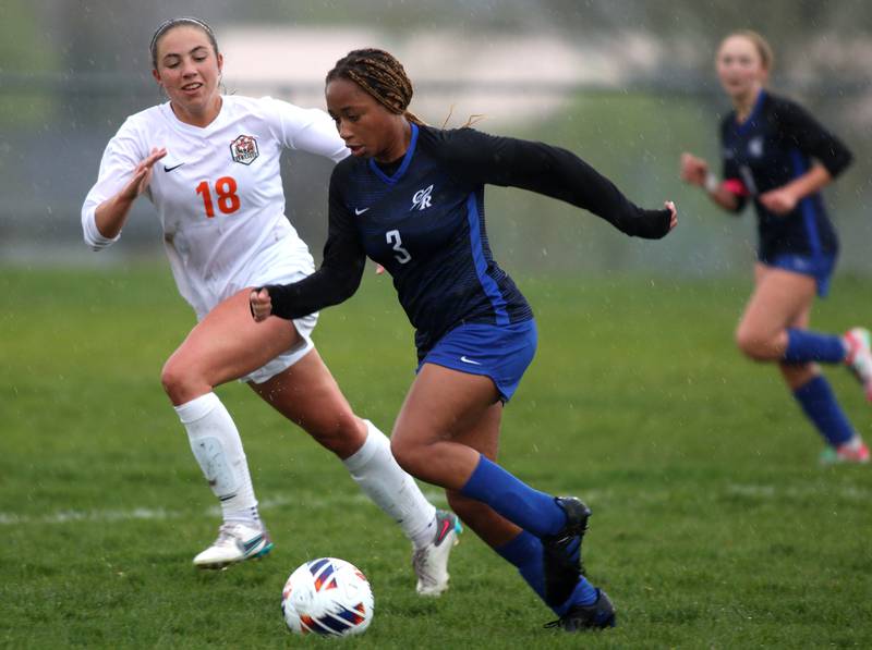 Burlington Central’s Mekenzie Rogers, front, moves the ball as Crystal Lake Central’s Sadie Quinn follows the action in varsity soccer during a game this season at Burlington.