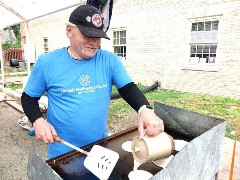 William Sherry of St. Charles prepares pancakes at the Memorial Day Pancake Breakfast 2024 at the United Methodist Church of Geneva.