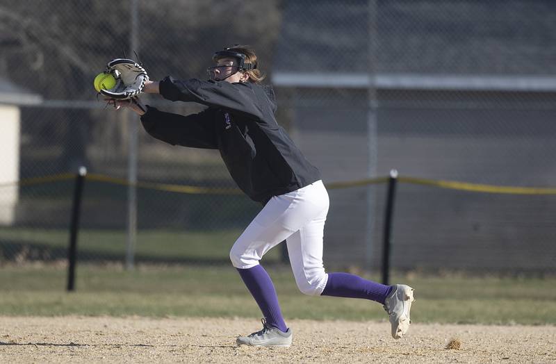 Dixon’s Kennedy Haenitsch has a line drive tip off her glove against Sterling Tuesday, March 19, 2024 in Dixon.