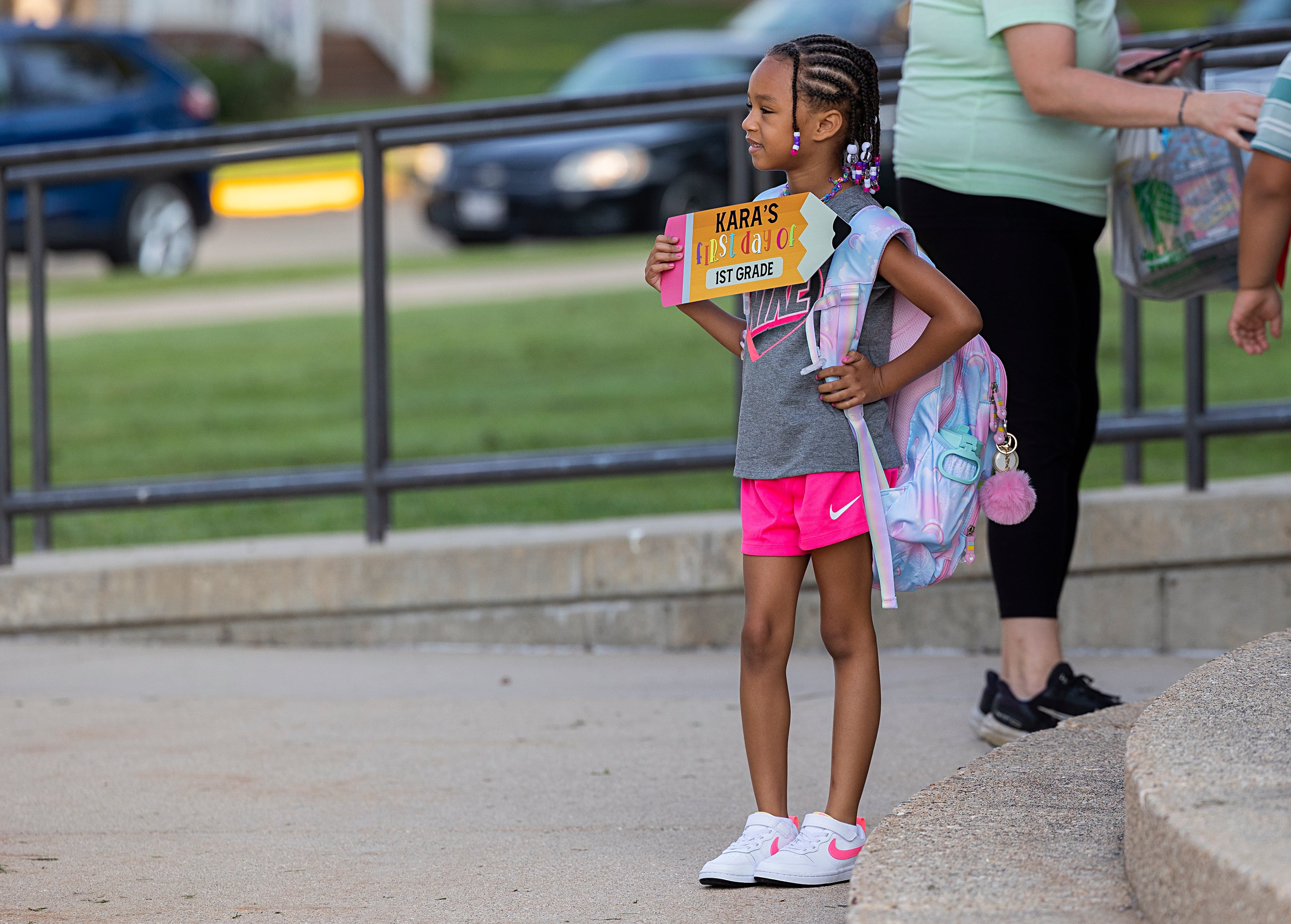 First grader Kara Westmorland has her picture taken by mom Alexa Monroe Wednesday, Aug. 14, 2024 outside of Washington School in Dixon. Kids throughout the Sauk Valley went back to school Wednesday after the summer break.