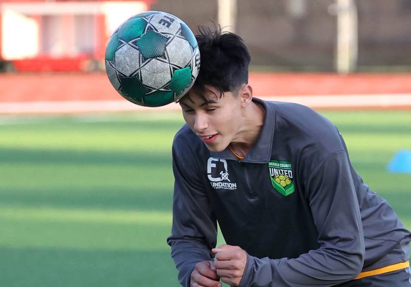 DeKalb County United’s Ilir Redzepi, from DeKalb, heads the ball during practice Thursday, June 6, 2024, at the Northern Illinois University Soccer and Track and Field Complex in DeKalb.