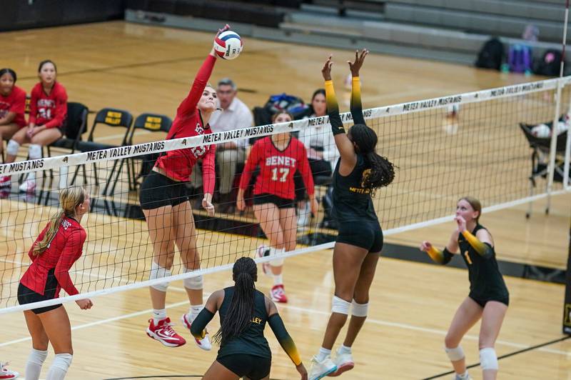 Benet’s Lynney Tarnow (12) goes up for a kill against Metea Valley's Olivia Stewart (8) during a volleyball match at Metea Valley High School in Aurora on Wednesday, Sep 4, 2024.