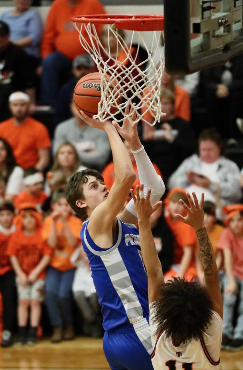 Princeton senior Tyson Phillips scores for the Tigers in Tuesday's game at Kewanee. The Tigers fell in overtime 64-59.