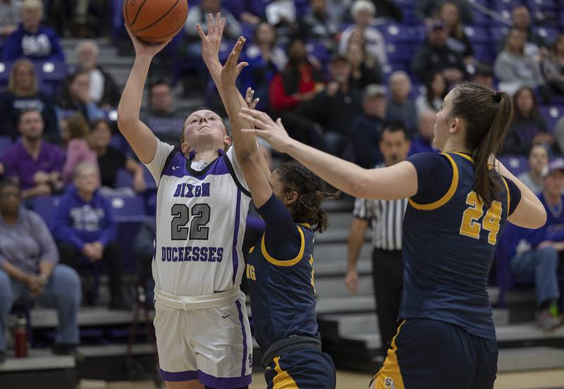 Dixon’s Katie Drew puts up a shot against Sterling’s Delali Amankwa Tuesday, Feb. 13, 2024 during a regional semifinal at Rochelle.