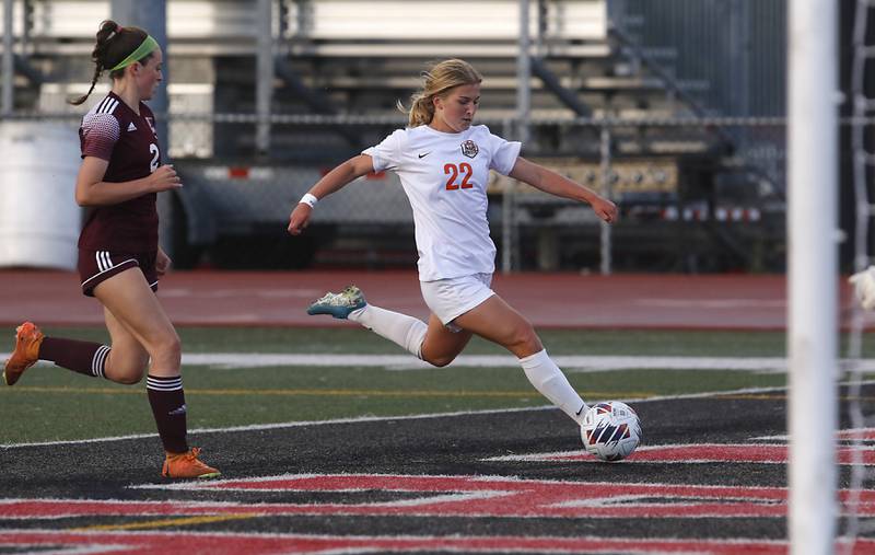 Crystal Lake Central's Olivia Anderson takes a shot on goal in front of St. Ignatius College Prep's Quinn Urquhart during the Class 2A Deerfield Supersectional girls soccer match on Tuesday, May 28, 2024, at Deerfield High School.