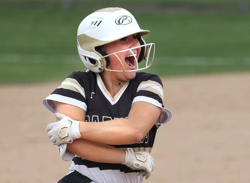 Sycamore's Addison McLaughlin reacts after finding out her hit cleared the fence for a homer during their game against Ottawa Thursday, May 2, 2024, at Sycamore High School.