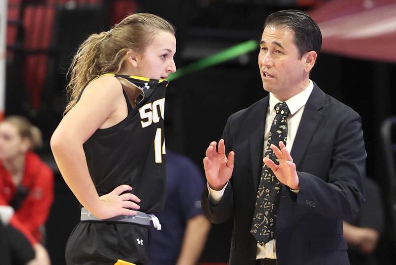 Hinsdale South Head Coach Scott Tanaka talks to Amelia Lavorato during their game against Glenwood Friday, March 1, 2024, in the IHSA Class 3A state semifinal at the CEFCU Arena at Illinois State University in Normal.