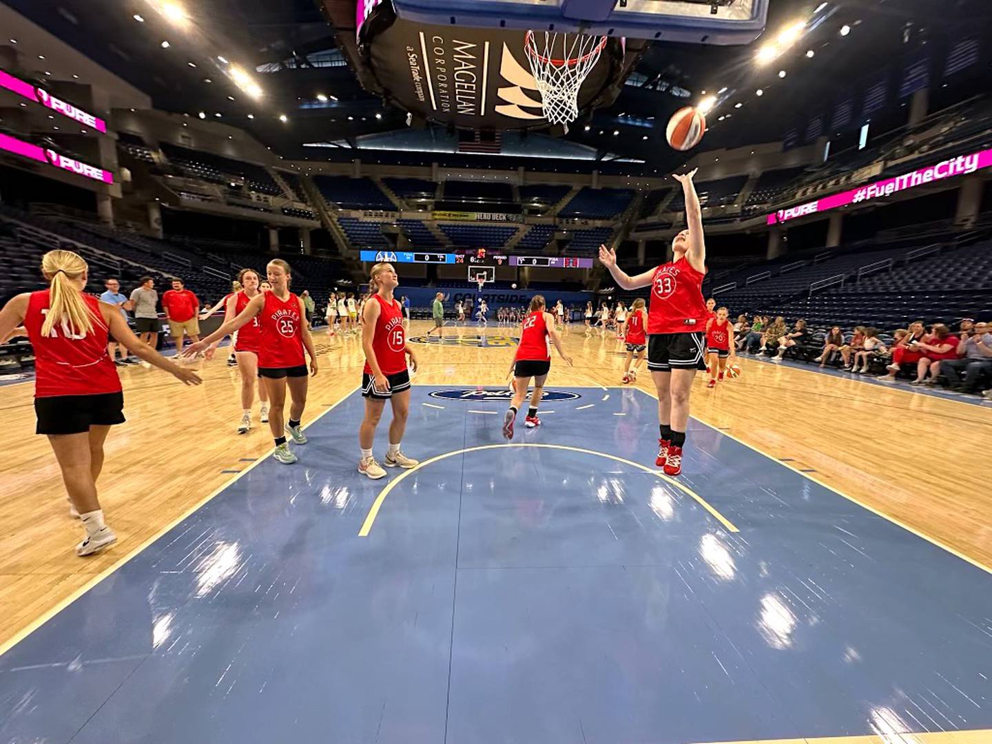 The Ottawa Pirates girls basketball team warms up before its summer scrimmage against Geneseo on Wednesday, June 12, 2024, at Wintrust Arena in Chicago, home of the WNBA's Chicago Sky.