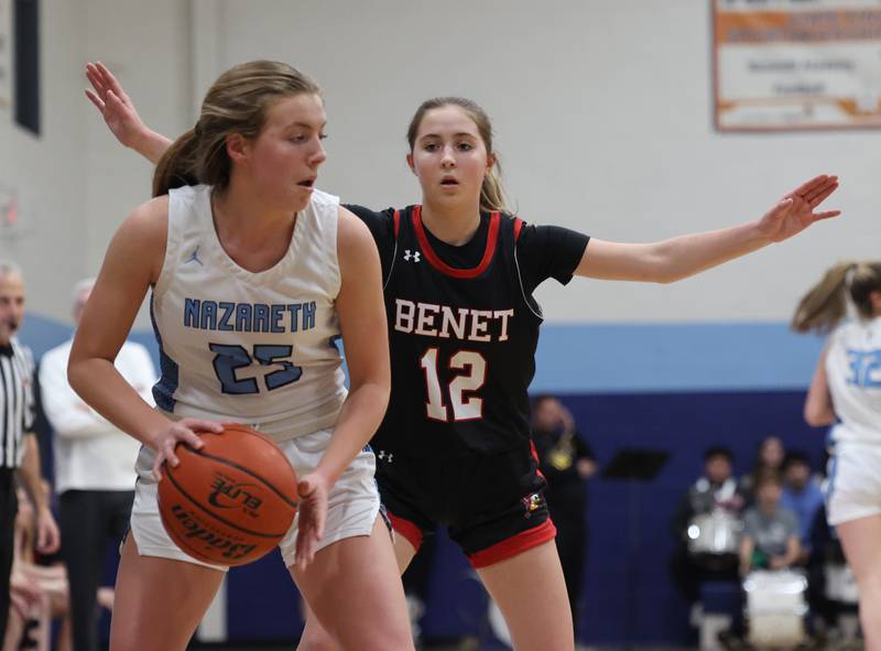 Benet’s Lindsay Harzich (12) defends Nazareth’s Amalia Dray (25) during a girls varsity basketball game on Monday, Jan. 29, 2024 in La Grange Park, IL.