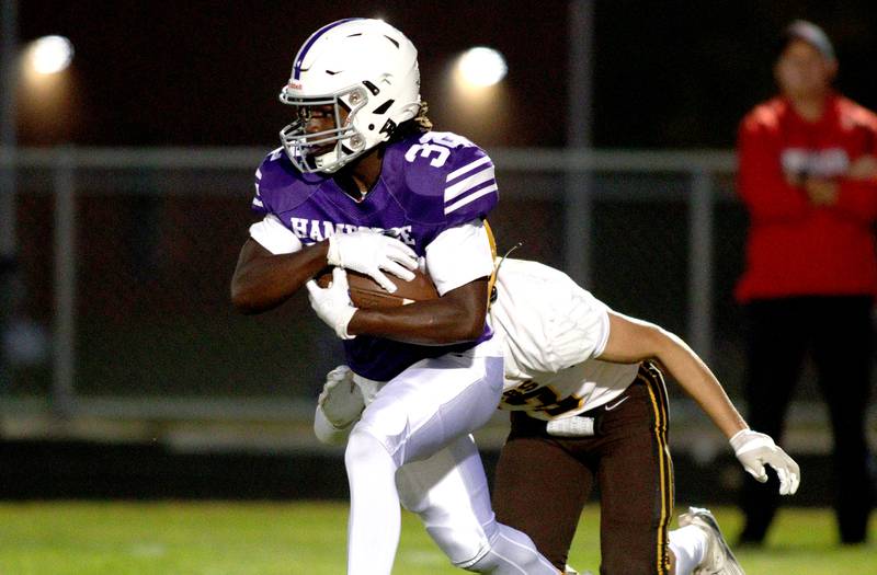 Hampshire’s Tymere Marshall runs the ball against Jacobs in varsity football on Friday, Sept. 6, 2024, at Hampshire School in Hampshire.