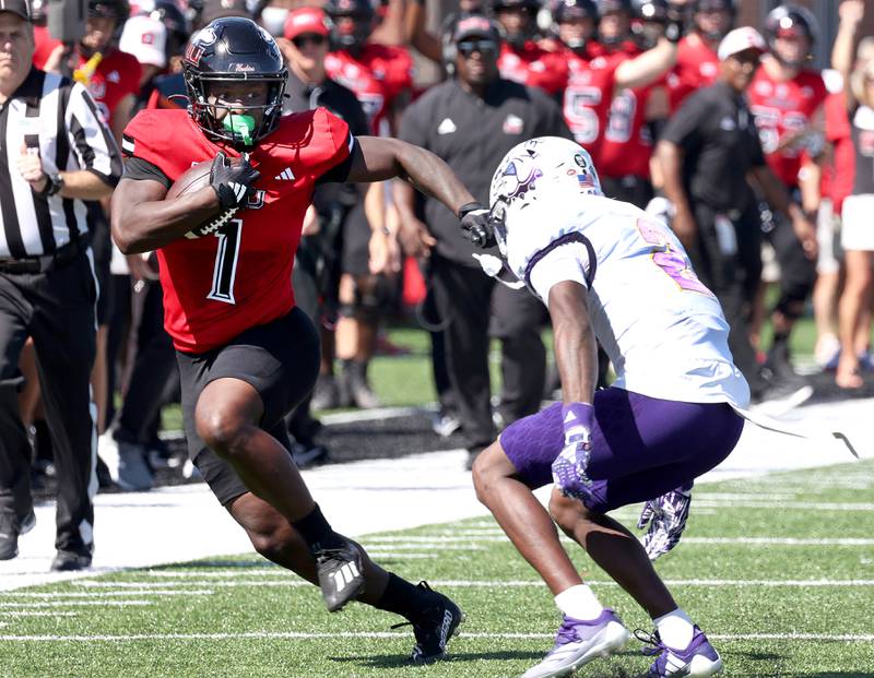 Northern Illinois' Antario Brown puts a move on Western Illinois' Willie Jones during their game Saturday, Aug. 31, 2024, in Huskie Stadium at NIU in DeKalb.