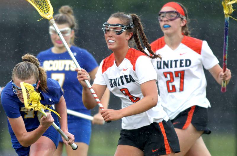 Crystal Lake Central’s Fiona Lemke, center, and Anna Starr, right, pursue Lake Forest’s Maeve Farrell, left, during girls lacrosse supersectional action at Metcalf Field on the campus of Crystal Lake Central Tuesday.