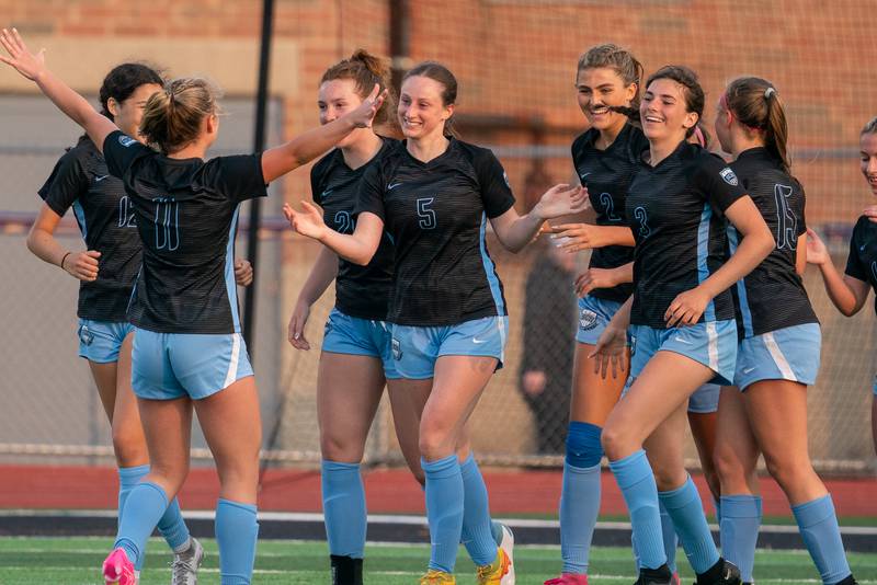 St. Charles North's Rian Spaulding (5) smiles after scoring a goal against Wheaton Warrenville South during the Class 3A girls soccer regional final at St. Charles North High School on Friday, May 19, 2023.