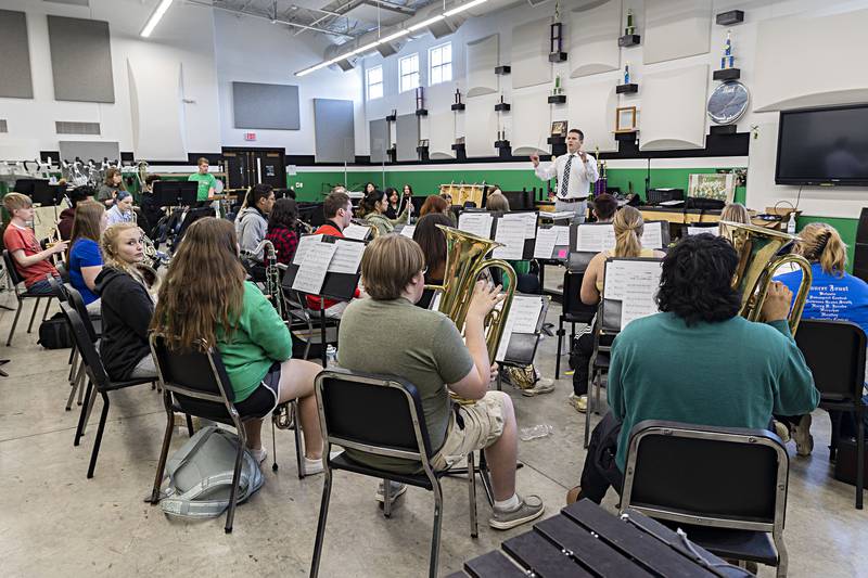 Rock Falls band director Patrick Anderson leads his group during practice Tuesday, April 11, 2023.