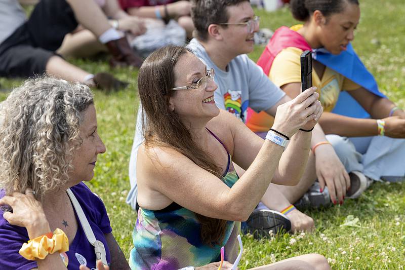 Fans take pictures and video of performers Saturday, June 15, 2024 at Dixon Pride Fest.