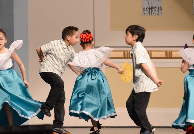 Various grade levels and schools including Congress Park Elementary students (left) Joaquin Geringer and Lucas Acuirre perform in the La Grange District 102 Expo de Bellas Artes at Park Junior High School on Friday, April 19, 2024.