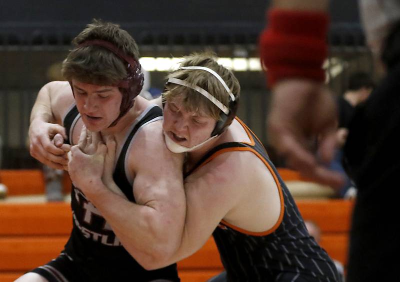 Crystal Lake Central Tommy McHeil tries to control Prairie Ridge\s John Fallaw during the 215-pound championship match of a the IHSA 2A Crystal Lake Central Wrestling Regional on Saturday, Feb. 3, 2024, at Crystal Lake Central High School.