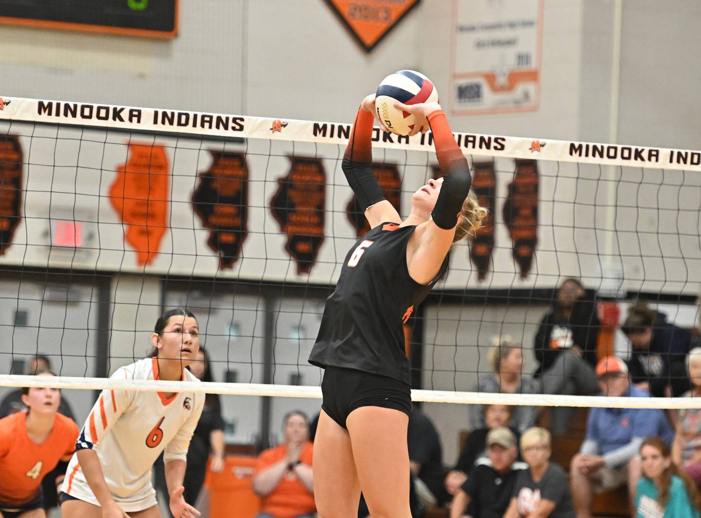 Minooka's Kendall Kozak sets the ball during a conference game against Romeoville on Tuesday, Oct. 03, 2023, at Minooka. (Dean Reid for Shaw Local News Network)