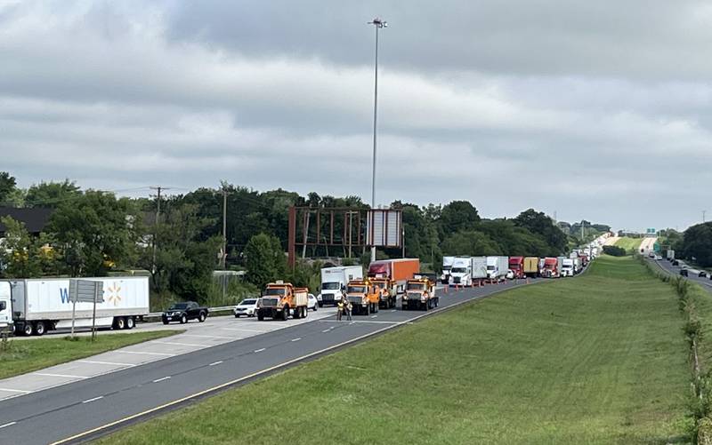 Trucks are backed up on southboud lanes of Interstate 55 near Channahon as vehicles are being rerouted because the interstate was blocked by storm damage and downed power lines Tuesday, July 16, 2024.