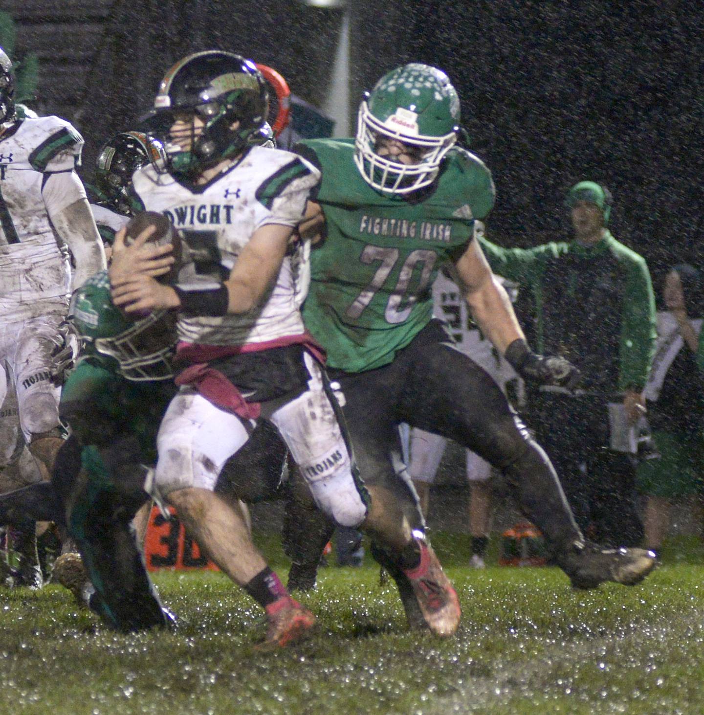 Seneca’s Chris Peura grabs hold of Dwight/Gardner-South Wilmington quarterback Conner Telford on a run in the first quarter of Friday's Class 2A playoff game at Seneca.