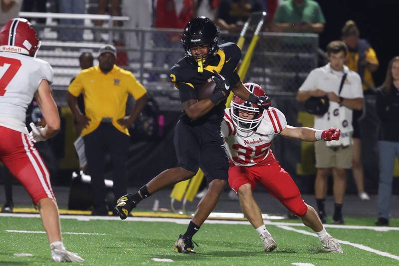 Joliet West’s Gerard Bush spins away from Yorkville’s Max McCarty on Friday, Sept. 13, 2024 in Joliet.