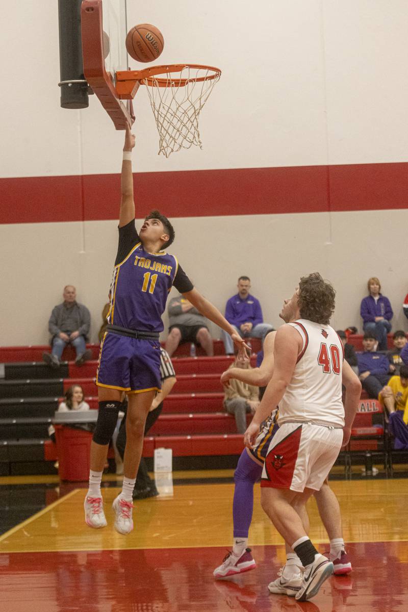 Izaiah Nanez extends Mendota's lead over Hall during the IHSA 2A Regional Semifinal at Hall High School on February 19, 2024.