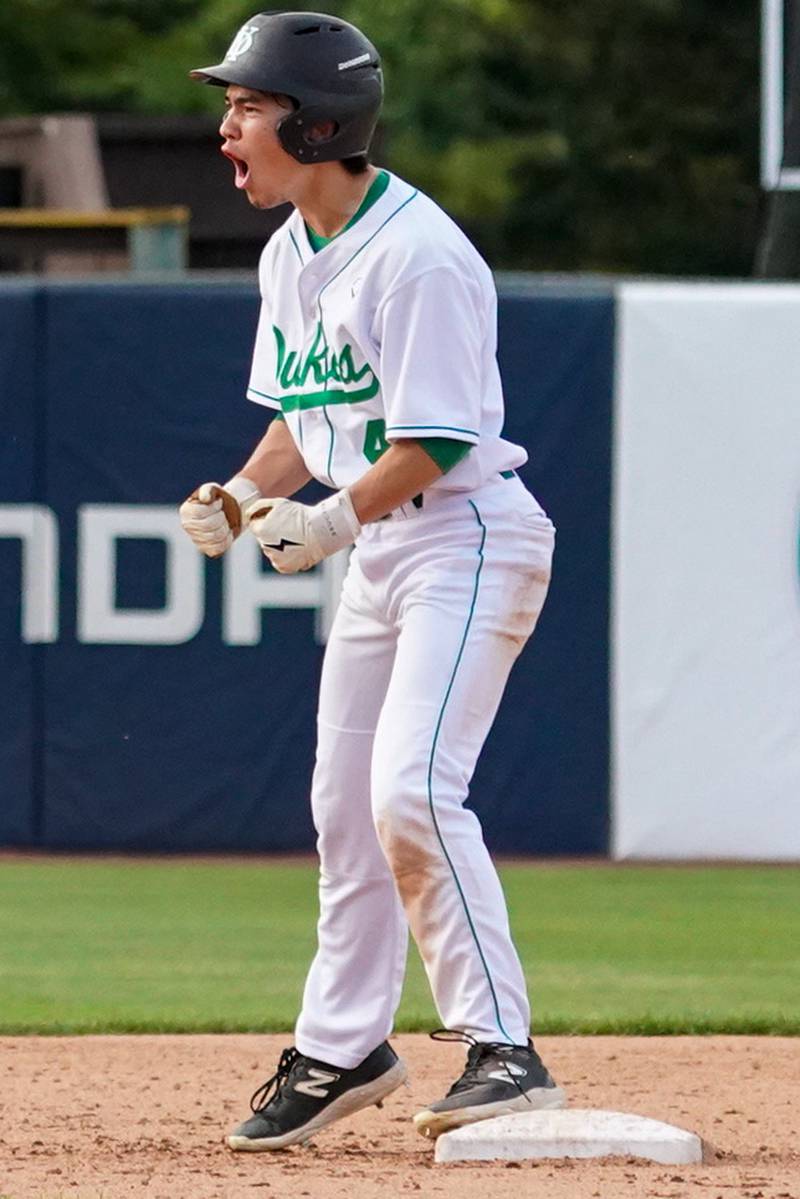 York's Austin Grzywa (4) reacts after reaching second on a throwing error by McHenry during a class 4A Kane County supersectional baseball game at Northwestern Medicine Field in Geneva on Monday, June 3, 2024.