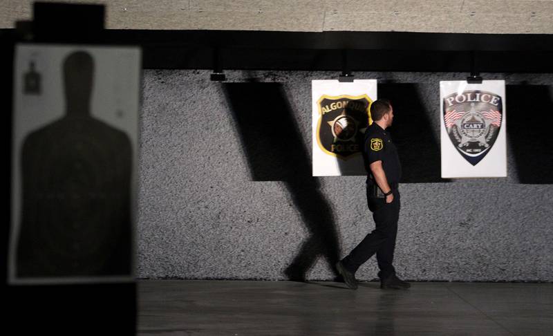 Algonquin Police Deputy Chief Tim Cooney checks out the firing range during an open house at The McHenry County Regional Training Center in Cary Tuesday evening.