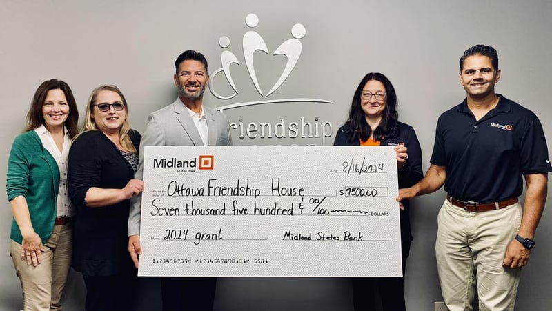 The Midland States Bank Foundation donated $7,500 to Ottawa Friendship House. Representatives from Midland States Bank pose with Tony Barrett, Friendship House executive director (third from left).