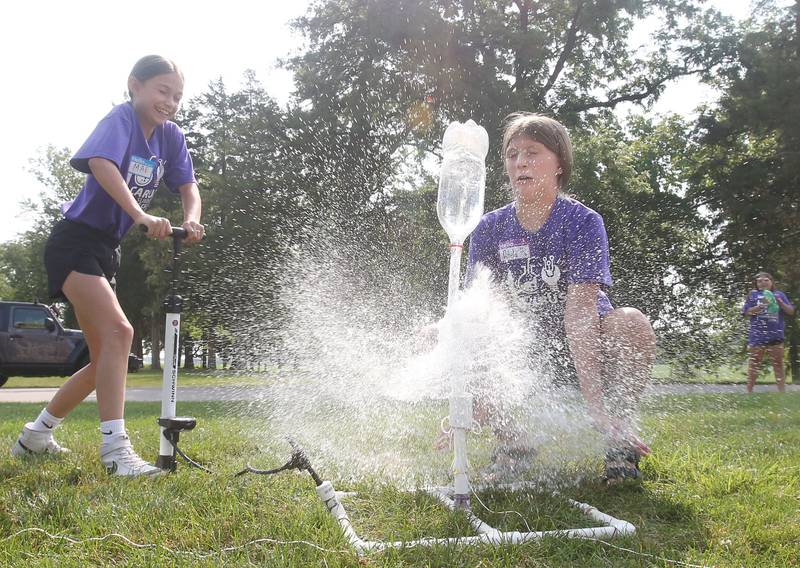 Mae Meyer and Adela Turigilatti launch a two liter rocket bottle during the 22nd annual Carus Summer Science Camp on Friday, July 12, 2024 at St. Bede Academy. The Carus Summer Science Camp has been a highlight for students in La Salle, Bureau, and Putnam counties, offering an opportunity for hands-on learning in the fields of science and chemistry. Led by a team of local teachers, participants will engage in experiments and expeditions designed to ignite their curiosity and passion for STEM (science, technology, engineering and mathematics).