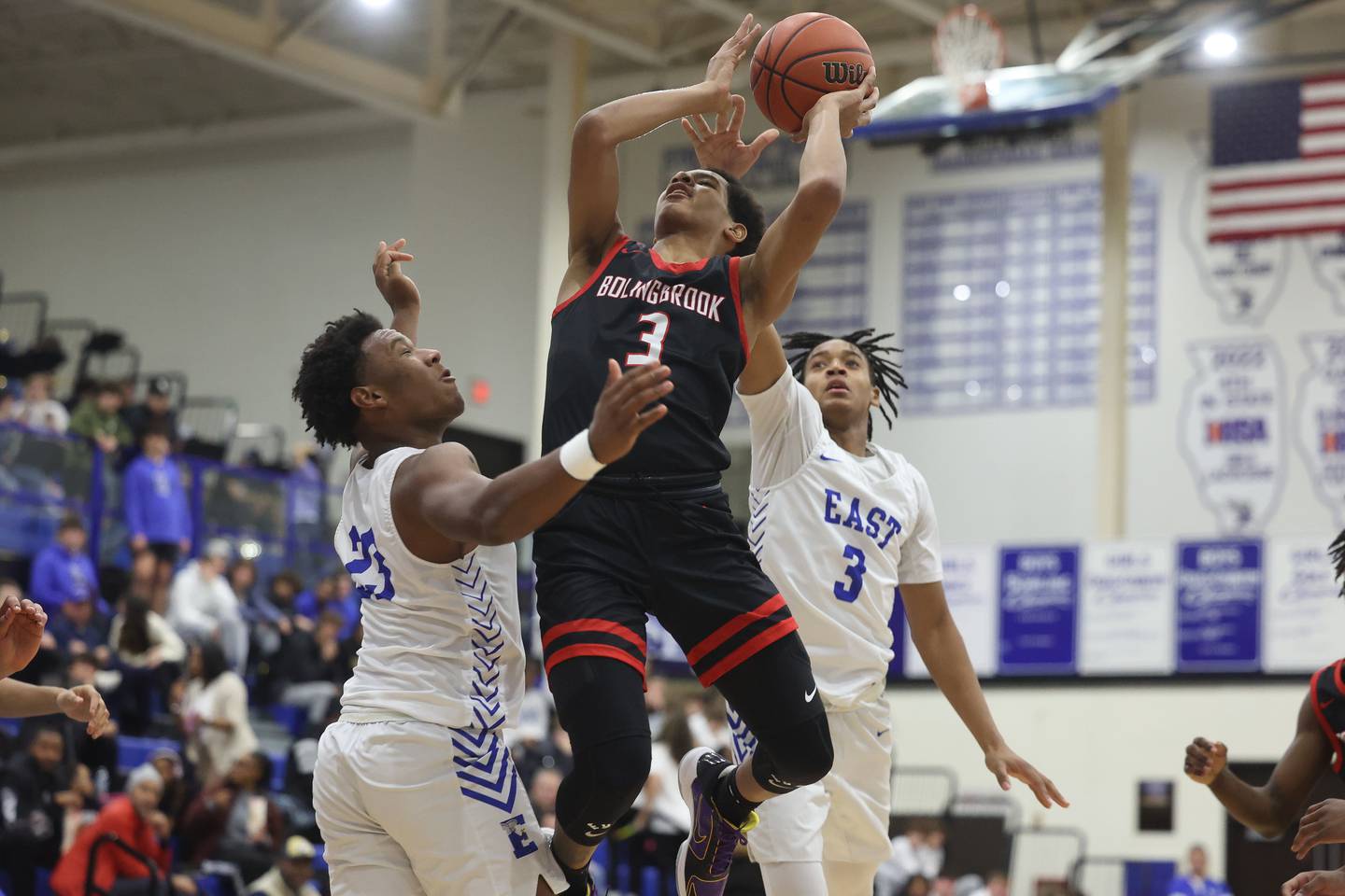 Bolingbrook’s Davion Thompson draws the foul going for the shot against Lincoln-Way East on Tuesday, Dec.12th, 2023 in Frankfort.